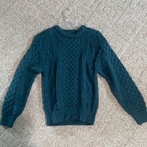 This sweater is from Ireland and it was bought there. It’s a size Small.